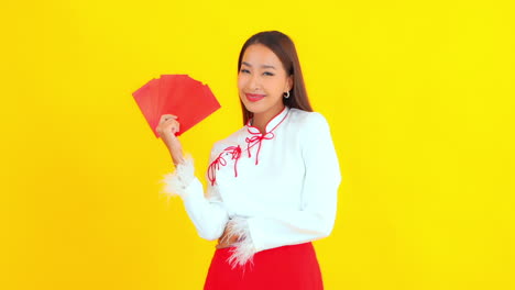 An-attractive-young-woman-holds-a-fan-of-cards-available-for-composite