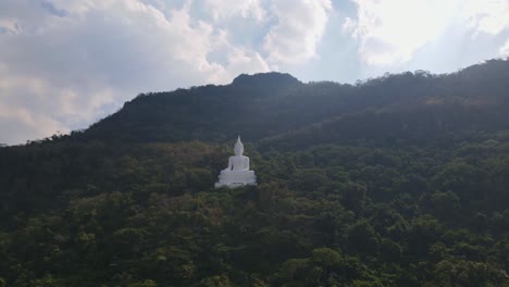 Luang-Por-Khao,-Wat-Theppitak-Punnaram,-a-4k-footage-towards-this-landmark-of-a-Giant-White-Buddha-Statue-in-Pak-Chong,-Thailand