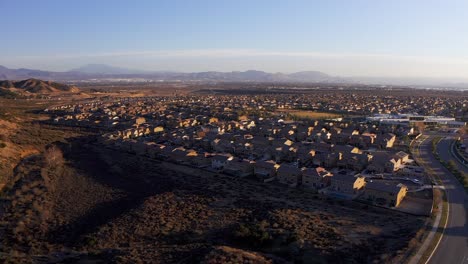 Aerial-reverse-pull-back-shot-of-a-master-planned-community-in-the-desert