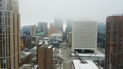 Aerial-Shot-of-Foggy-Minneapolis-Skyline-in-Winter