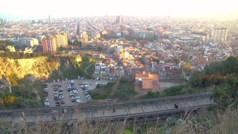Handheld-shot-looking-down-at-a-little-village-in-the-city-of-Barcelona-on-a-bright-day