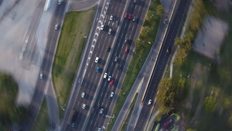 Vertigo-circular-rotation-pov-of-cars-and-vehicles-driving-on-General-Paz-highway-in-Buenos-Aires,-Argentina