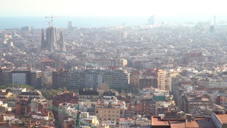 Handheld-static-looking-down-at-the-city-of-Barcelona-with-La-Sagrada-Familia-in-the-background