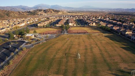 Wide-aerial-shot-of-athletic-fields-and-recreation-center-in-a-desert-master-planned-community