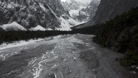 Yulong-Jade-Dragon-Snow-Mountain,-old-glacier-river-valley,-black-and-white