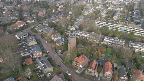 Aerial-of-monumental-water-tower-in-suburban-neighbourhood