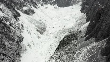 Yulong-mountainside-glacier,-historic-shrinking-glacier-in-Yunnan-China,-aerial