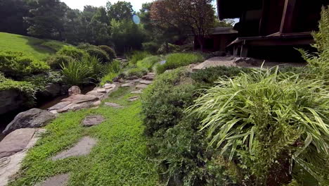 Steadicam-shot-moving-along-path-of-Japanese-tea-garden,-or-Roji