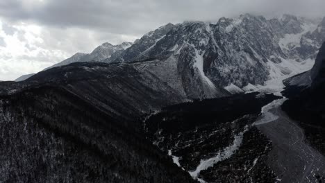 Aerial:-Yulong-old-glacial-valley,-Jade-Dragon-Mountain-China,-black-and-white