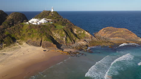 Sugarloaf-Point-Lighthouse,-rugged-New-South-Wales,-Australia-east-coast,-aerial