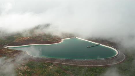 Aerial-of-Barragem-do-Pico-da-Urze-in-mist,-water-reserve-of-Madeira-island