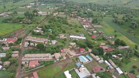Countryside-Landscape-With-Green-Fields-And-Farmlands-Surrounding-Town-Loitokitok-In-Kenya---aerial-drone-shot