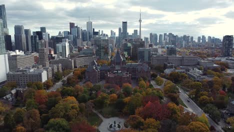 Wide-Aerial-of-Queen's-Park-and-Toronto-skyline-revealing-large-city-building-developments