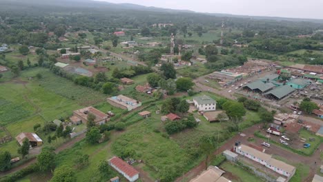 Drone-Flying-Over-Houses,-Fields,-And-Street-At-Loitokitok-Town-In-Kajiado-County,-Kenya