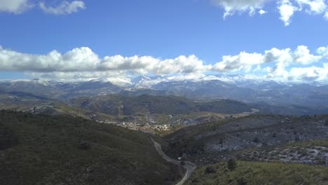 Drone-view-on-a-sunny-day-of-the-mountain-range-of-Sierra-Nevada-in-Granada,-Spain