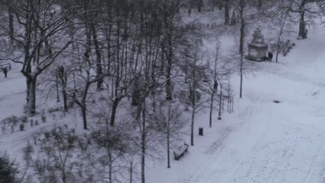 Aerial-shot-of-Warandepark-in-the-snow,-Brussels-Park,-Brussels,-Belgium