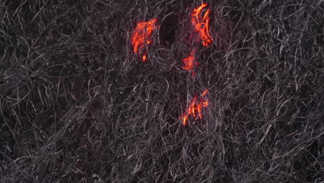 Fire-wave-traveling-on-steel-wool-fibers--close-up