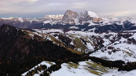 Panoramic-aerial-view-of-Langkofel,-Plattkofel-and-Dolomites-mountain-range-from-Seiser-Alm---Alpe-di-Siusi-plateau-in-South-Tyrol,-Italy-around-sunset