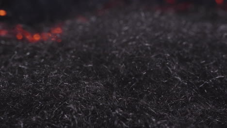 Fire-waves-creeping-through-steel-wool--close-up