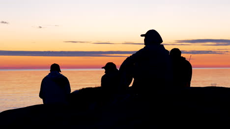 Group-of-friends-enjoying-sunset-and-seascape-horizon-view