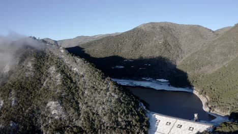 Jade-Dragon-Snow-Mountain-lake-dam,-aerial-winter-view