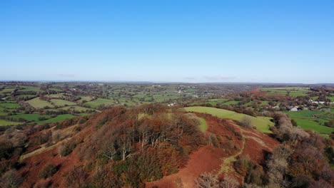 Aerial-backwards-shot-ofCountryside-and-Dumpdon-Hill-Honiton-Devon-England-UK