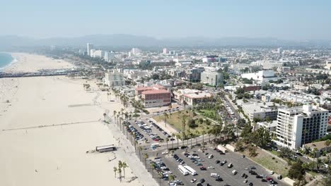 Scenic-aerial-above-Los-Angeles-panoramic-suburb-rising-pull-back-revealing-beach-skyline