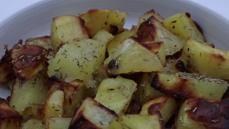 Delicious-roasted-potatoes-with-rosemary-on-rotating-display
