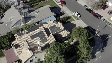 Aerial-orbit-view,-residential-neighborhood-with-solar-renewable-panels-on-roof