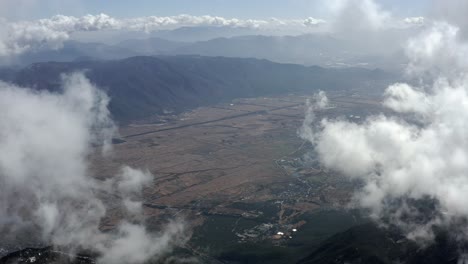 Aerial:-Jade-Dragon-Snow-Mountain-overlooking-Yulong-Lijiang,-Yunnan-China