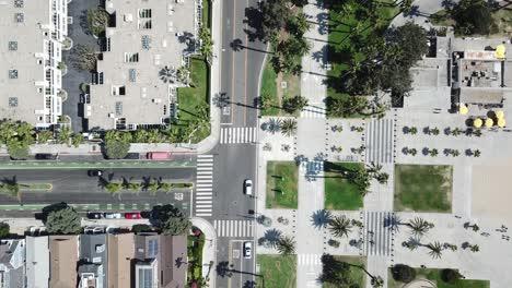 Aerial-rising-birdseye-above-Los-Angeles-downtown-urban-neighbourhood-streets