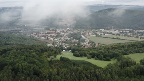 Aerial-Shot-Of-Alpine-Mountain-Landscape-Surrounding-A-Small-Rural-City-In-Czech-Republic