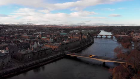 Aerial-flyover-the-Tay-River-with-cityscape-during-sunny-and-cloudy-day-in-Perth,Scotland