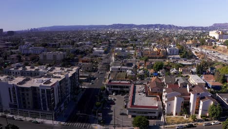 Aerial-reverse-pull-back-shot-of-Echo-Park-with-Hollywood-in-the-background