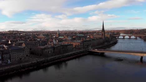 Descending-drone-shot-over-River-Tay-and-beautiful-historic-cityscape-with-church-in-Perth,Scotland