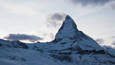 Famous-Matterhorn-Mountain-in-morning-hours-at-sunrise,-winter-wonderland-at-swiss-alps-zermatt-glacier-ski-resort