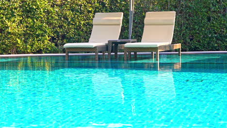 Empty-Pool-Chairs-on-Poolside-of-Luxury-Hotel-Resort,-Full-Frame