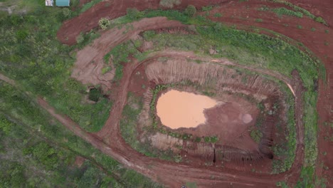 Dry-water-pond-in-African-farm-in-aerial-above-drone-shot
