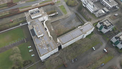 Aerial-of-solar-panels-on-office-building-rooftop
