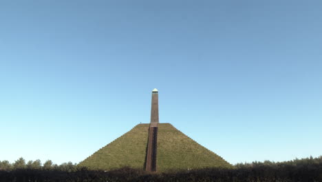 Tilting-from-bright-blue-sky-to-Austerlitz-Pyramid-monument-in-the-Netherlands