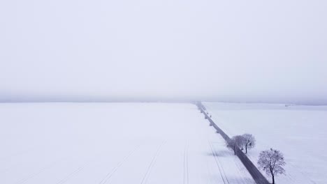Farmland-covered-with-a-thin-layer-of-snow