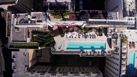 Aerial-bird's-eye-shot-of-a-luxury-rooftop-pool