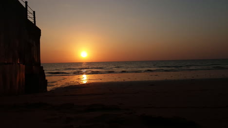 Timelapse-of-sunset-over-ocean-from-sand-beach-at-Khao-Lak,-Thailand