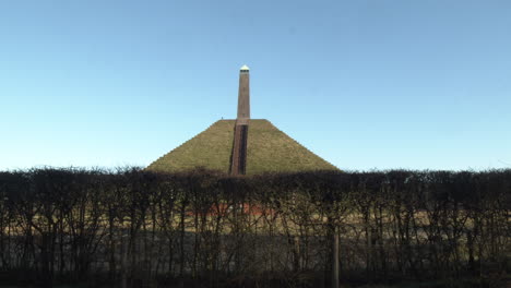 Tilt-up-to-Austerlitz-Pyramid-monument-agains-a-bright-blue-sky