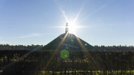 wide-shot-Time-lapse-of-sun-appearing-behind-obelisk-on-Austerlitz-Pyramid