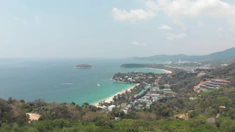 Wide-view-over-Karon-Beach-vast-blue-ocean-coast-in-Phuket,-Thailand---Aerial-high-wide-panoramic-view