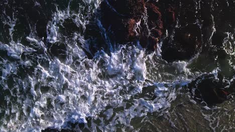 Aerial-view-of-ocean-waves,-moving-up