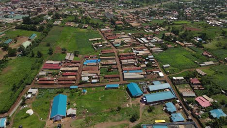 Flying-Over-The-Residential-Areas-In-Rural-Town-In-Kilimanjaro,-Kenya---Aerial-Drone-Shot