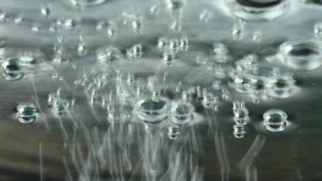 Macro-shot-of-various-air-bubbles-in-rising-water
