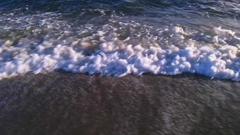 Ocean-waves-at-the-beach,-moving-sideways